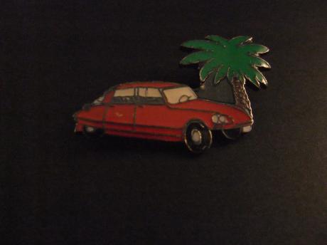 Citroën DS19 rood met palmboom